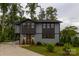 Charming two-story home with a well-manicured front yard and landscaping at 113 Angler Pl, Mooresville, NC 28117