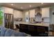 Kitchen featuring white cabinetry, granite counters, and island with seating at 113 Angler Pl, Mooresville, NC 28117