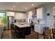 Modern kitchen with island, stainless appliances, and bar stool seating at 113 Angler Pl, Mooresville, NC 28117