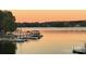 Scenic lakeside view with docks and boats, reflecting the sunset at 113 Angler Pl, Mooresville, NC 28117