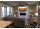Inviting living room with a fireplace, lake views, comfortable seating, and large windows at 113 Angler Pl, Mooresville, NC 28117