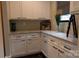 Well-organized pantry with granite countertops, white cabinetry, and modern black hardware at 113 Angler Pl, Mooresville, NC 28117