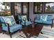 Relaxing outdoor patio area with cushioned seating and a coffee table with accents at 113 Angler Pl, Mooresville, NC 28117