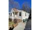 Charming home exterior with landscaped front yard and covered porch at 1217 Spruce St, Charlotte, NC 28203