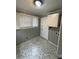 Room featuring patterned flooring, access door, and functional cabinet at 1217 Spruce St, Charlotte, NC 28203