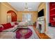 Living room features an L-shaped sofa, fireplace, and built-in shelving at 143 Reid St, Rock Hill, SC 29730