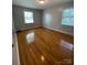 Bright bedroom with hardwood floors and multiple windows at 1615 Bonnie Ln, Charlotte, NC 28213