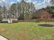 Landscaped backyard with storage shed and privacy fence at 1903 Robbins Meadows Dr, Waxhaw, NC 28173