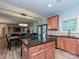 Kitchen with granite island, stainless steel appliances, and hardwood floors at 1903 Robbins Meadows Dr, Waxhaw, NC 28173