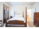 Cozy bedroom with a wooden bed frame, ample closet space, and dresser at 2019 Stoney Point Cir, Monroe, NC 28112