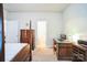 Bedroom with a desk, dresser, and view into adjacent bathroom at 2019 Stoney Point Cir, Monroe, NC 28112