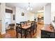 Bright dining room featuring a wood table with six chairs, adjacent to kitchen at 2019 Stoney Point Cir, Monroe, NC 28112