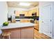 Galley kitchen with stainless steel appliances and light wood cabinets at 2019 Stoney Point Cir, Monroe, NC 28112