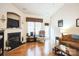 Living room boasts hardwood floors, fireplace, and access to patio at 2019 Stoney Point Cir, Monroe, NC 28112
