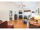Living room features hardwood floors, fireplace, and access to bedroom at 2019 Stoney Point Cir, Monroe, NC 28112
