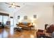 Living room with hardwood floors, fireplace, and ample natural light at 2019 Stoney Point Cir, Monroe, NC 28112