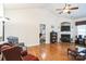 Living room features hardwood floors, fireplace, and access to bedroom at 2019 Stoney Point Cir, Monroe, NC 28112