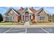 A brick clubhouse with manicured landscaping and ample parking at 2231 N Castle Ct, Matthews, NC 28105