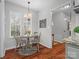 Cozy breakfast nook with wood table and chairs, near kitchen at 2717 New Hamlin Way, Charlotte, NC 28210