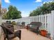 Relaxing patio with wicker furniture and a brick paved surface at 2717 New Hamlin Way, Charlotte, NC 28210