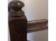 Close-up of a stained wood stair railing post featuring a curved detail and polished finish at 2855 Yeager Dr, Concord, NC 28027