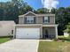 Two-story house with neutral siding, white garage door, and landscaping at 3259 Maple Ridge Dr, Gastonia, NC 28052
