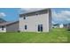 Rear view of house showcasing back yard and sliding glass door at 3259 Maple Ridge Dr, Gastonia, NC 28052