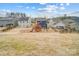 Backyard view of houses with solar panels and fenced yards at 3594 Cerelia Ln, Denver, NC 28037