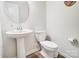 Clean and simple bathroom with pedestal sink and toilet at 3594 Cerelia Ln, Denver, NC 28037