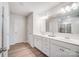 Double vanity bathroom with a large mirror and a walk-in shower at 3594 Cerelia Ln, Denver, NC 28037
