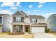 Two-story brick home with attached garage and landscaping at 3594 Cerelia Ln, Denver, NC 28037