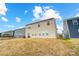 Rear view of tan house with fenced backyard at 3594 Cerelia Ln, Denver, NC 28037