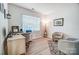 Bright home office features built-in shelving and hardwood floors at 3594 Cerelia Ln, Denver, NC 28037