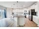 Modern kitchen with white cabinets, granite countertops, and island at 3594 Cerelia Ln, Denver, NC 28037