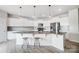 Modern kitchen with white cabinets, granite countertops, and a large island at 3594 Cerelia Ln, Denver, NC 28037