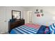 Bright bedroom with striped bedding and built-in dresser at 3727 13Th Ne St, Hickory, NC 28601