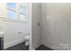 Modern bathroom with a large shower and hexagon tile floor at 414 W Harvie Ave, Gastonia, NC 28052