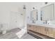 Modern bathroom with double vanity, large mirrors, and a walk-in shower at 414 W Harvie Ave, Gastonia, NC 28052