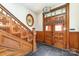 Grand entryway with ornate wood staircase and stained glass at 414 W Harvie Ave, Gastonia, NC 28052
