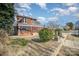 Two-story brick home with a screened porch and landscaping at 414 W Harvie Ave, Gastonia, NC 28052