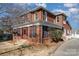 Brick home with screened porch and landscaped yard at 414 W Harvie Ave, Gastonia, NC 28052