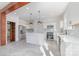 Modern white kitchen with stainless steel appliances and island at 414 W Harvie Ave, Gastonia, NC 28052