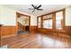 Living room showcasing hardwood floors and a view of the staircase at 414 W Harvie Ave, Gastonia, NC 28052