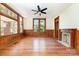 Bright living room with stained-glass window, hardwood floors, and fireplace at 414 W Harvie Ave, Gastonia, NC 28052