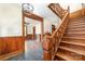 Intricate wood staircase, stained glass window and wood paneling at 414 W Harvie Ave, Gastonia, NC 28052