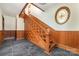 Ornate wood staircase with detailed banister and newel post at 414 W Harvie Ave, Gastonia, NC 28052
