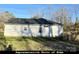 White vinyl sided home with a gray roof, and small yard at 4470 Kingsbury Rd, Midland, NC 28107