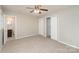 Bedroom with carpet, double closets and access to bathroom at 4630 Dawnwood Dr, Charlotte, NC 28212