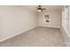 Spacious bedroom with neutral carpeting and large windows at 4630 Dawnwood Dr, Charlotte, NC 28212