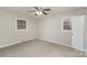 Bedroom with carpet, ceiling fan, and two windows at 4630 Dawnwood Dr, Charlotte, NC 28212